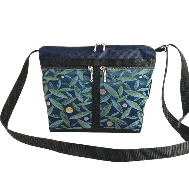 navy blue ballistic nylon crossbody purse with olive leaf patterned pockets